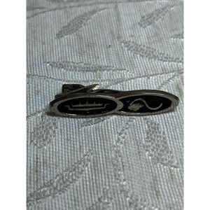 Vintage Anson tie clip featuring a crown and sine wave‎